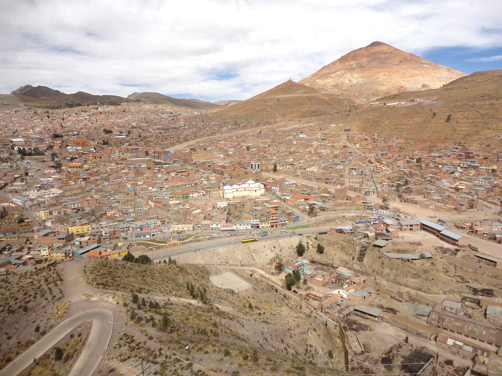 The city of Potosí and the Cerro Rico amidst the surrounding dry mountain landscape. (Photo by Andrea Marston.)