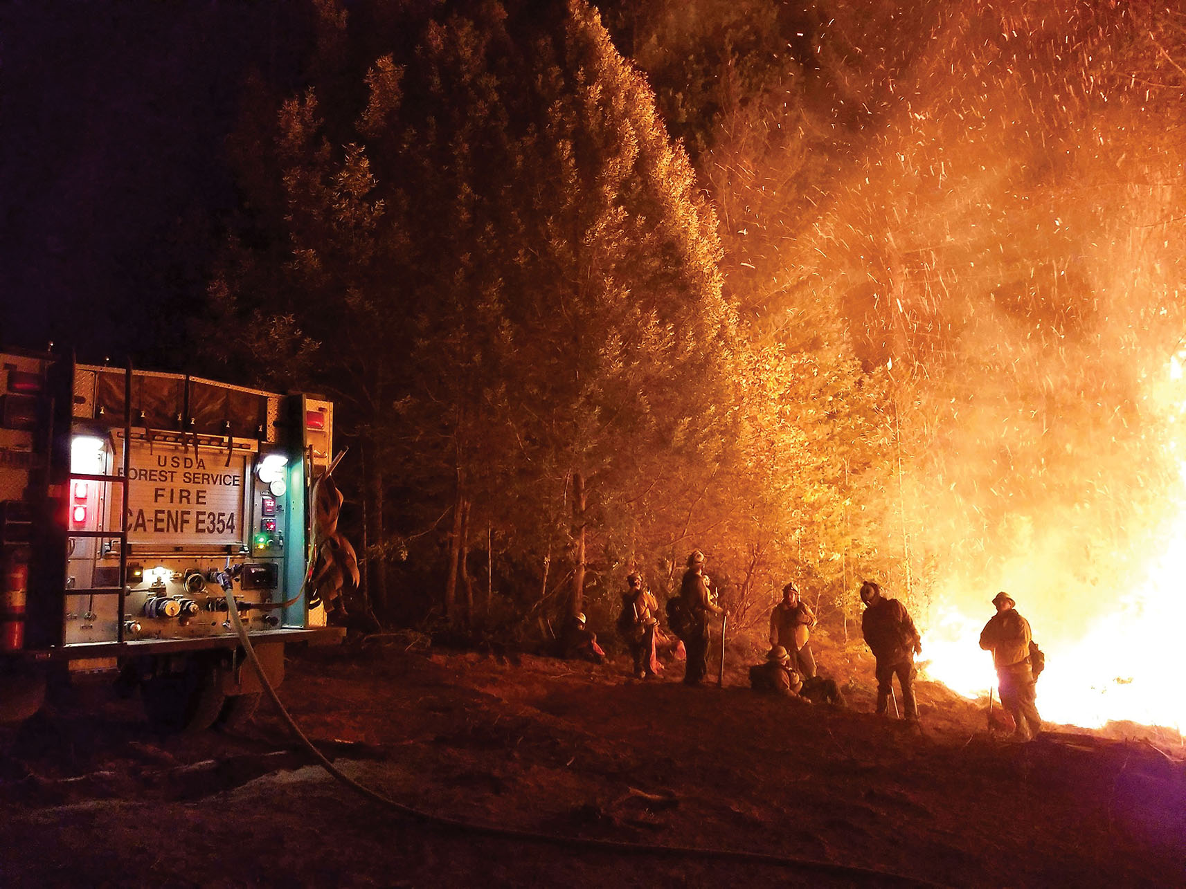 Firefighters battling the Camp Fire in northern California, 2018. (Photo courtesy of Pacific Southwest Region 5, U.S. Forest Service.) A photo of firefighters battling the Camp Fire in northern California, 2018. (Photo courtesy of Pacific Southwest Region 5, U.S. Forest Service.)