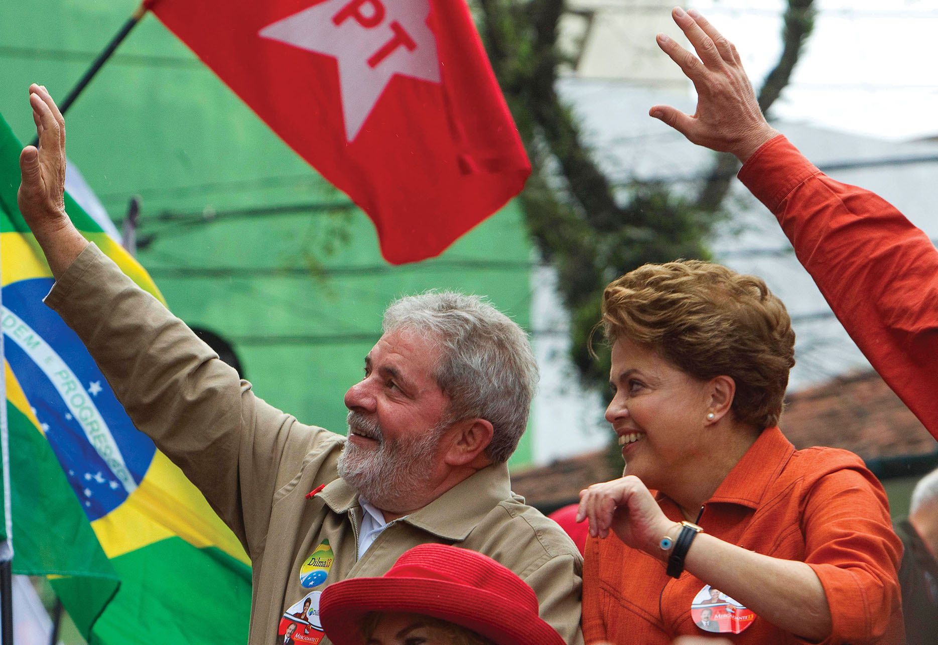 In a photo from a political rally, Luiz Inácio Lula da Silva and his successor, Dilma Rousseff, both represent the Worker's Party (PT). (Photo by Andre Penner/Associated Press.)