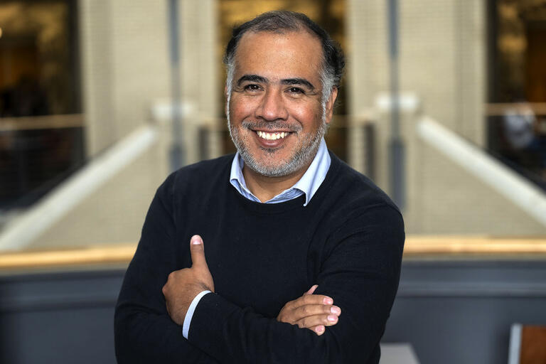 A portrait of Omar Gómez Trejo, bearded with a blue sweater. (Photo courtesy of Carnegie Mellon University Communications & Marketing.)