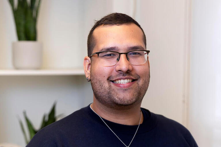 Portrait of Rodney Padovani in a blue sweatshirt.