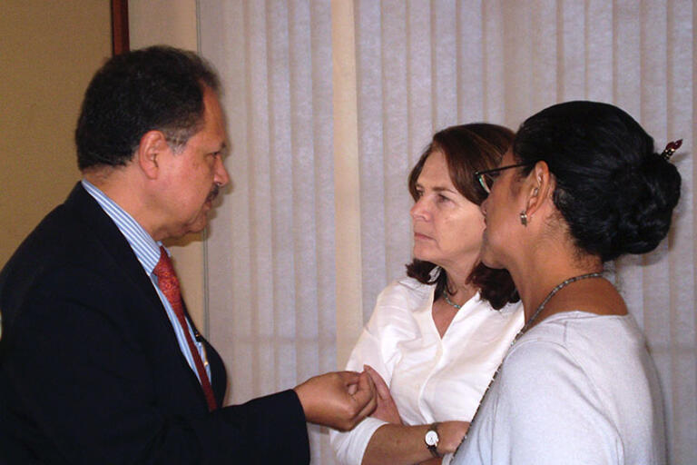 Ambassador Felix Corona speaks with Maria Blanco and Maria Echaveste after their talk.