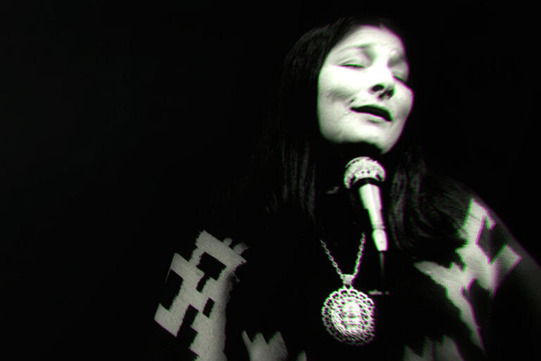 Black and white photo of Mercedes Sosa singing