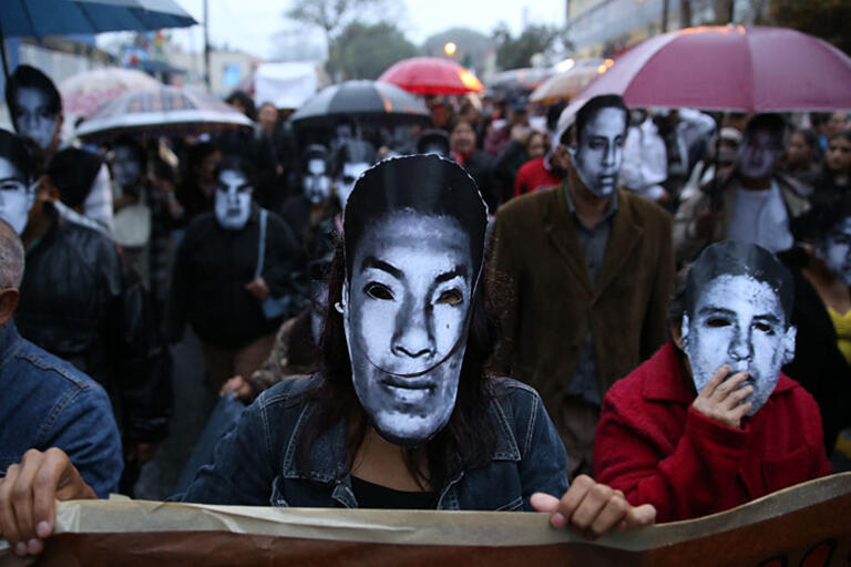 March in Xalapa, Veracruz, people wearing masks protesting the disappearance of the students in Ayotzinapa
