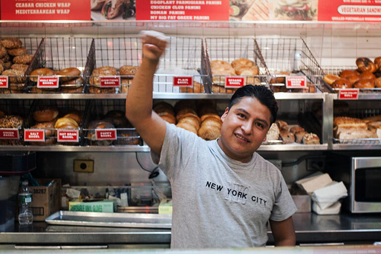 One of the workers featured in "The Hand That Feeds." A man standing in front of a bakery