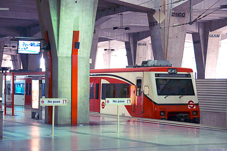 A commuter train waits in a Mexico City station