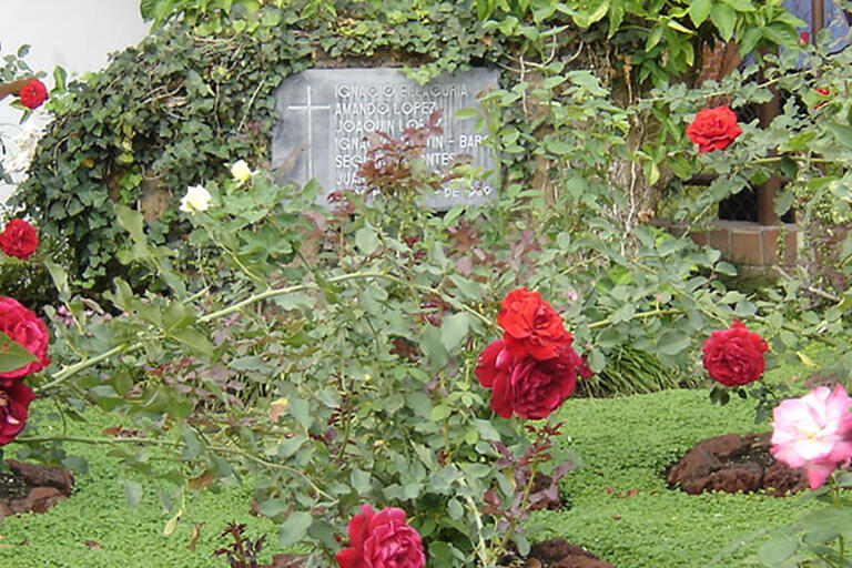 A rose garden and memorial planted at the site of the murders of six Jesuit priests, their housekeeper, and her daughter in El Salvador. (Photo by John Donaghy.)