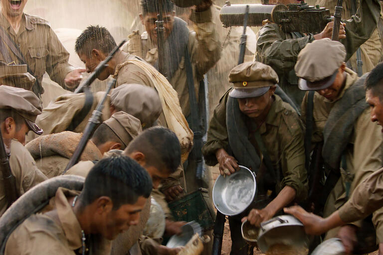 Still showing Bolivian soldiers in the rain during the Chaco War. From the film Chaco. (Image courtesy of Murillo Film.)