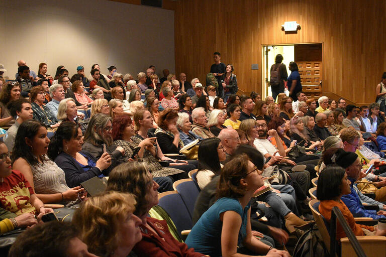 A crowd listens to speakers at a Center for Latin American and Caribbean Studies event.