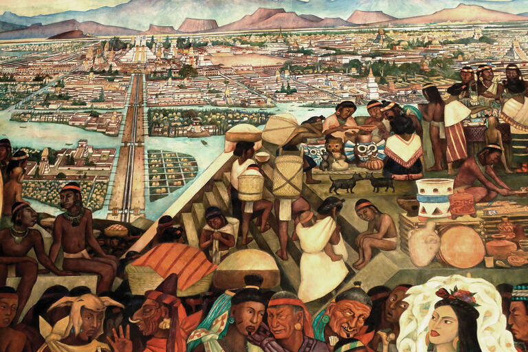 A photo showing detail of Diego Rivera’s mural of Aztec city life at Mexico’s Palacio Nacional. (Photo by kgv88/Wikimedia.)