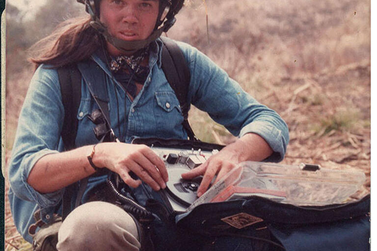 Pamela Yates wearing a soldier's helmet in the field during the filming of “When the Mountains Tremble,” 1982. (Photo by Newton Thomas Sige.)