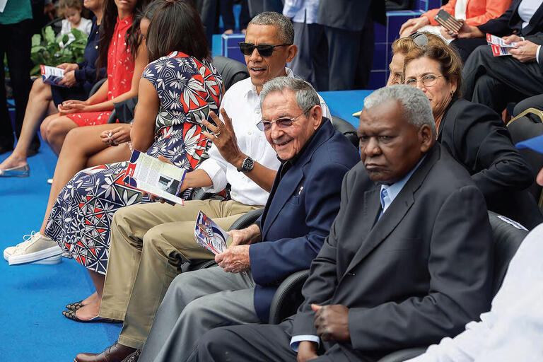 Barack Obama and his family take in a baseball game in Havana with Raúl Castro in March 2016. (Photo from the U.S. Department of State.)