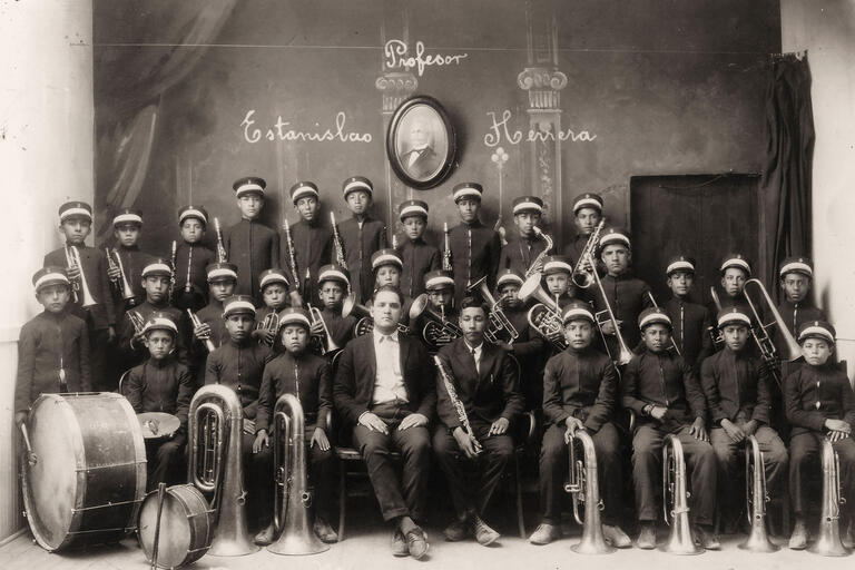 A Latin American military-style boys’ band poses with their instruments, 1903. (Photo from Wikimedia Commons.)