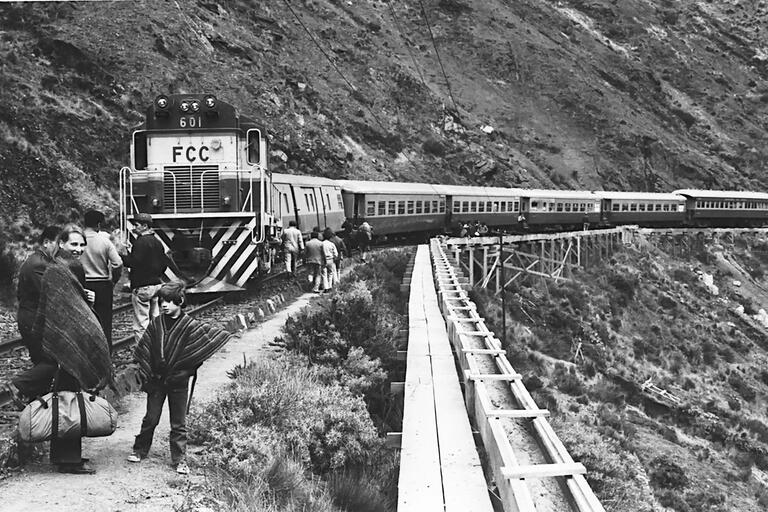 The author and his mother wait by their train in the Peruvian Andes. (Photo courtesy of Peter Andreas.)