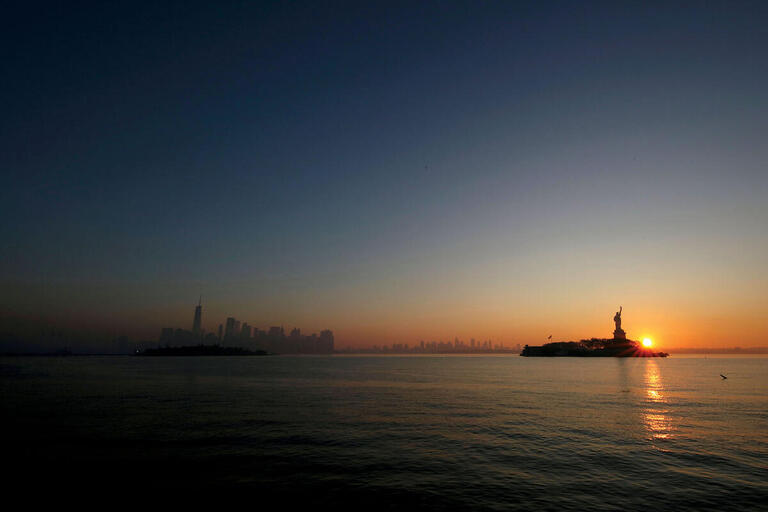 The Statue of Liberty at dawn, November 2020. (Photo by Aaron M. Sprecher/AP Photos.)
