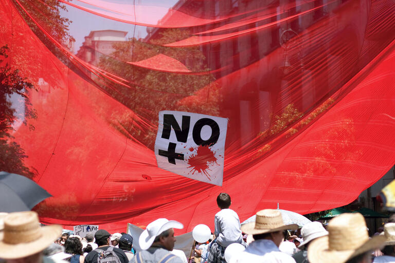 A banner reads "No more" at a 2011 mass demonstration against violence in Mexico City. (Photo by Damaris Vilchis.)