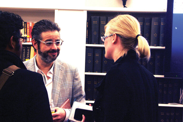 Isaac Lee speaks with audience members after his talk at Berkeley, February 2013. (Photo by Megan Kang.)