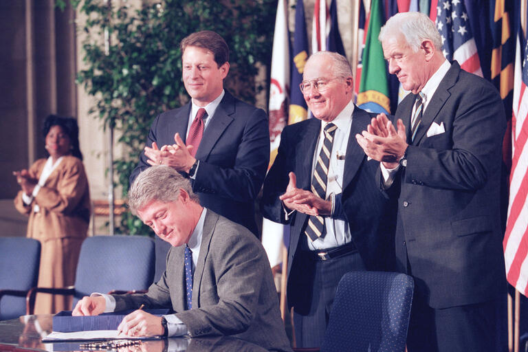 President Bill Clinton signs legislation implementing the North American Free Trade Agreement on December 8, 1993. (Photo by Doug Mills/Associated Press.)