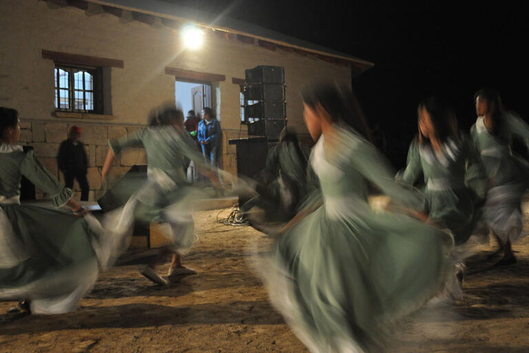 Local Indigenous women whirling through performing a traditional dance at the Museo Rural Communitario Barranca Larga, El Bolsón, Argentina. (Photo courtesy of Alejandra Korstanje.)