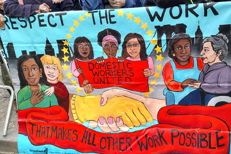 Mural painting that reads Respect the work, Domestic workers united, and that makes all other work possible