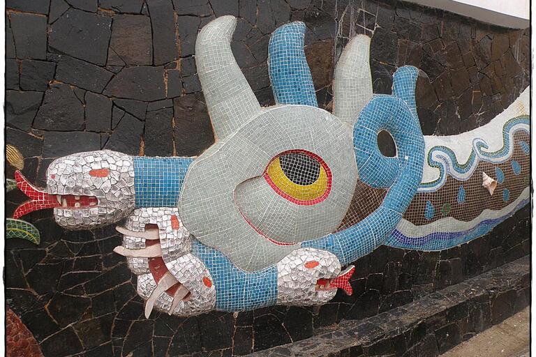 Mosaic sculpture of a serpent goddess.