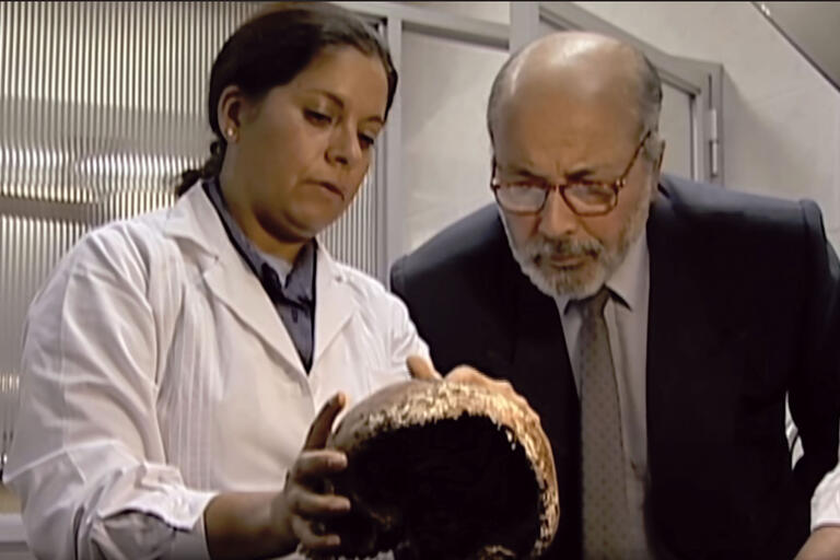 Judge Guzmán examines a victim’s skull with forensic anthropologist Isabel Reveco. (From The Judge and the General. Image courtesy of West Wind Productions.)