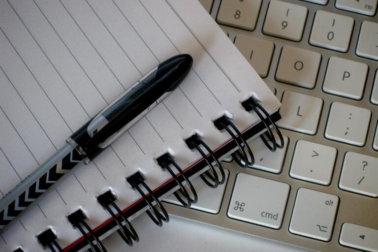 Image of pen, paper, and keyboard