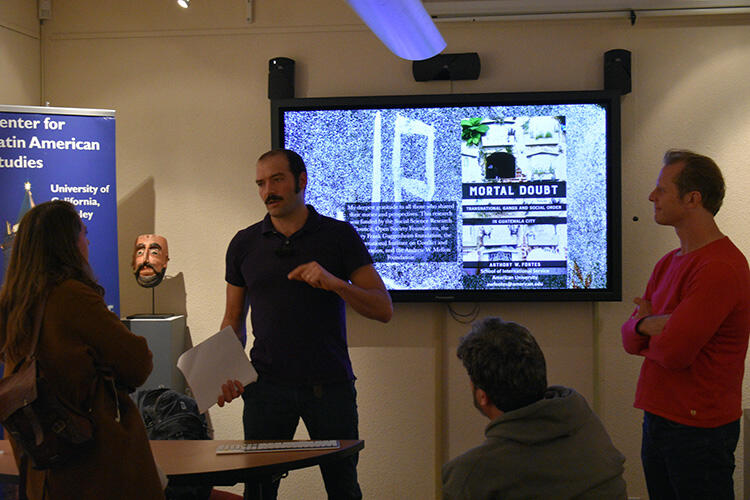 Fontes talks to attendees after the event. (Photo by Lissett Bastidas.) Fontes talks to attendees after the event