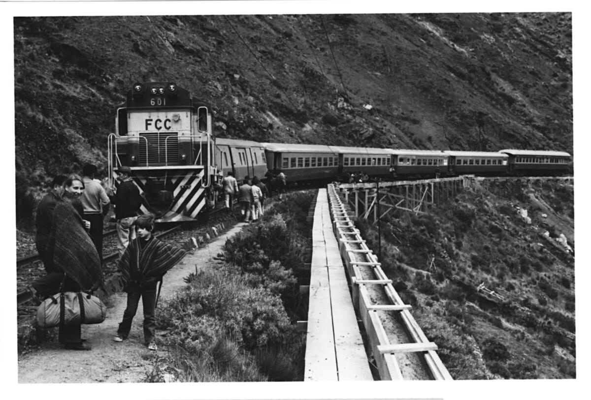 The author and his mother wait by their train in the Peruvian Andes.