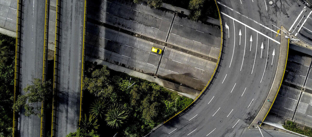 Empty highways with one yellow car