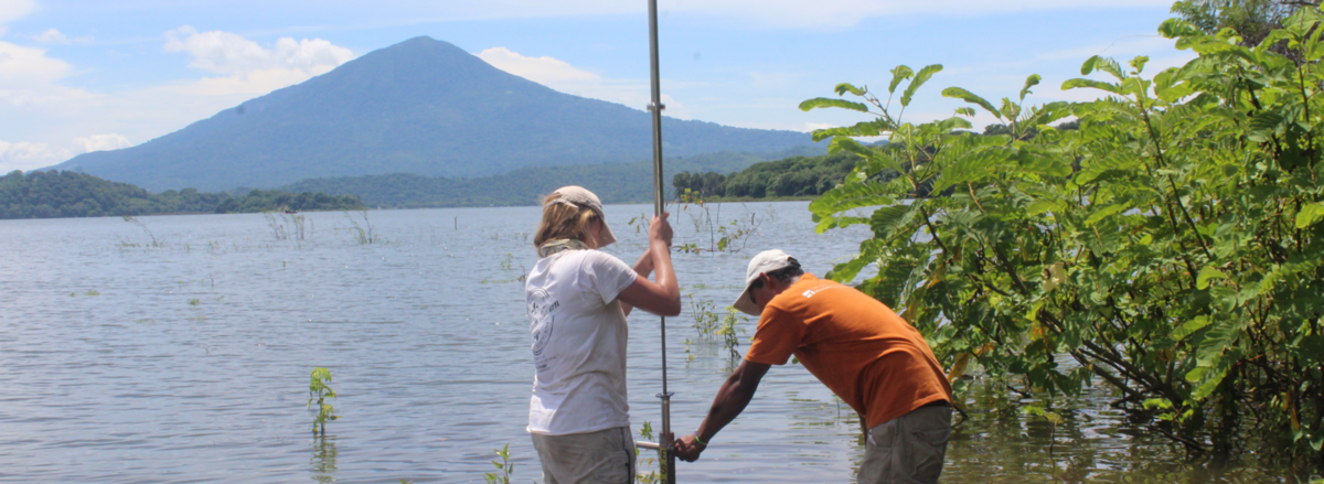 A Berkeley student and a research collaborator take measurements in a lake