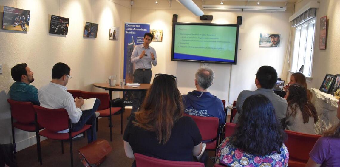 A professor talking to a room of people