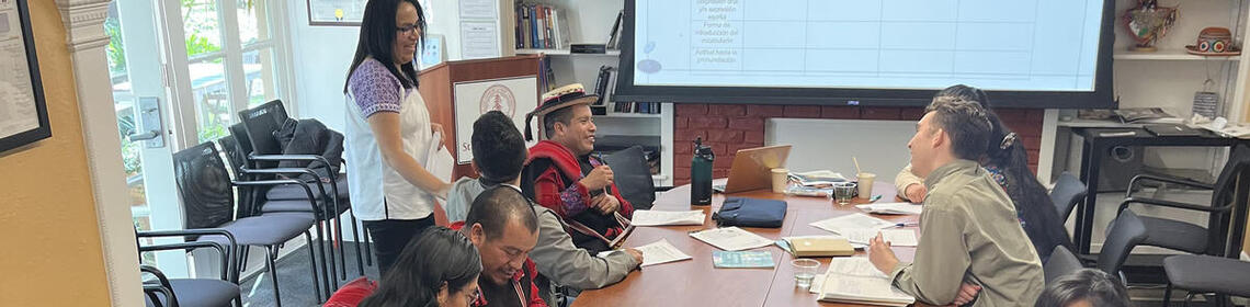 People sitting around a conference table, linked to Stanford's Indigenous Language Pedagogy symposium in April.