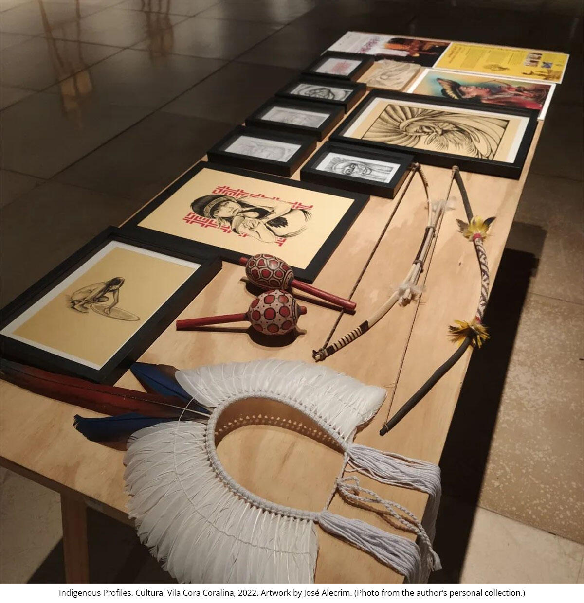 A tabletop display of Indigenous artworks. Indigenous Profiles. Cultural Vila Cora Coralina, 2022. Artwork by José Alecrim. (Photo from the author’s personal collection.)