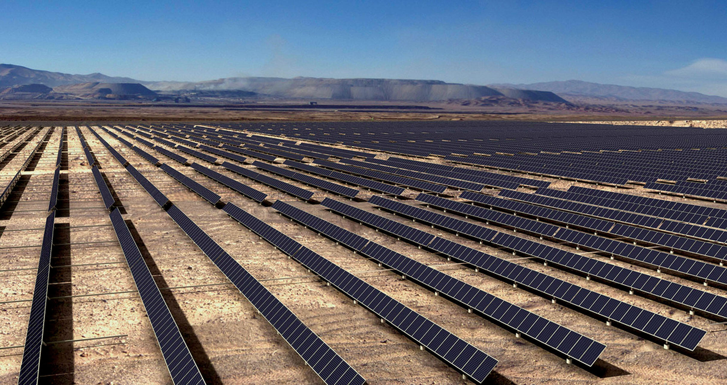 Rows and rows of photovoltaic panels form a huge solar farm in Chile’s Atacama Desert. (Photo by Jaim Peña.)