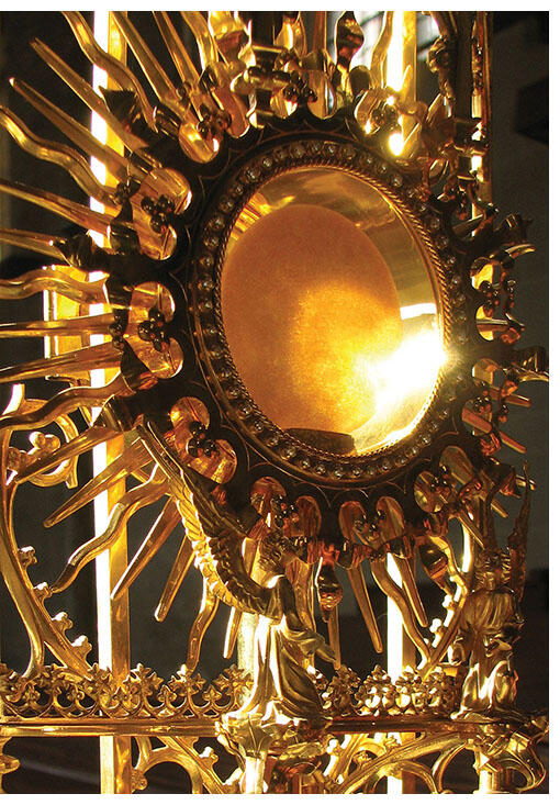 A golden monstrance holds the consecrated host. (Photo by Brother Lawrence Yew.)