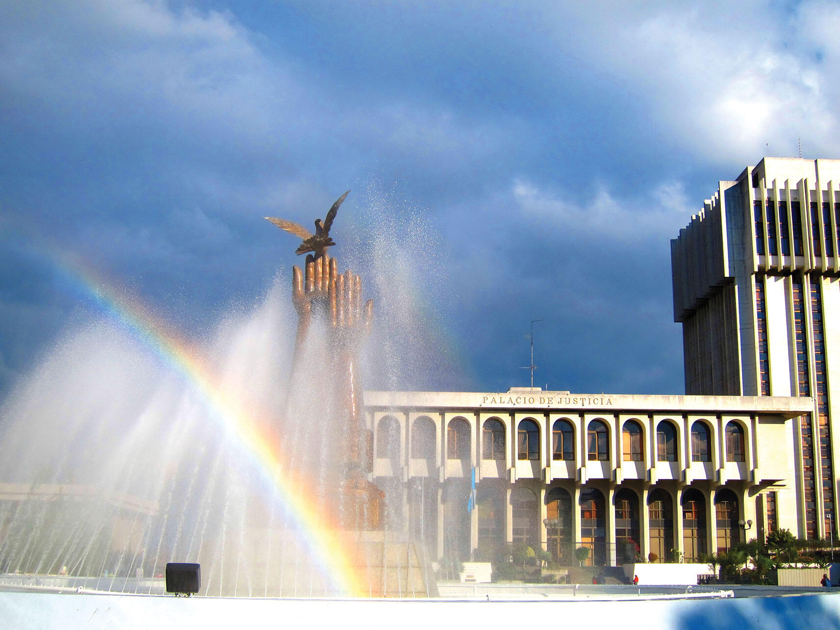 Water sprays and rainbows form in the “Hands of Peace” Fountain commemorating the signing of peace accords in 1996 lies just in front of the Palace of Justice in Guatemala City. (Photo by Anthony Fontes.)