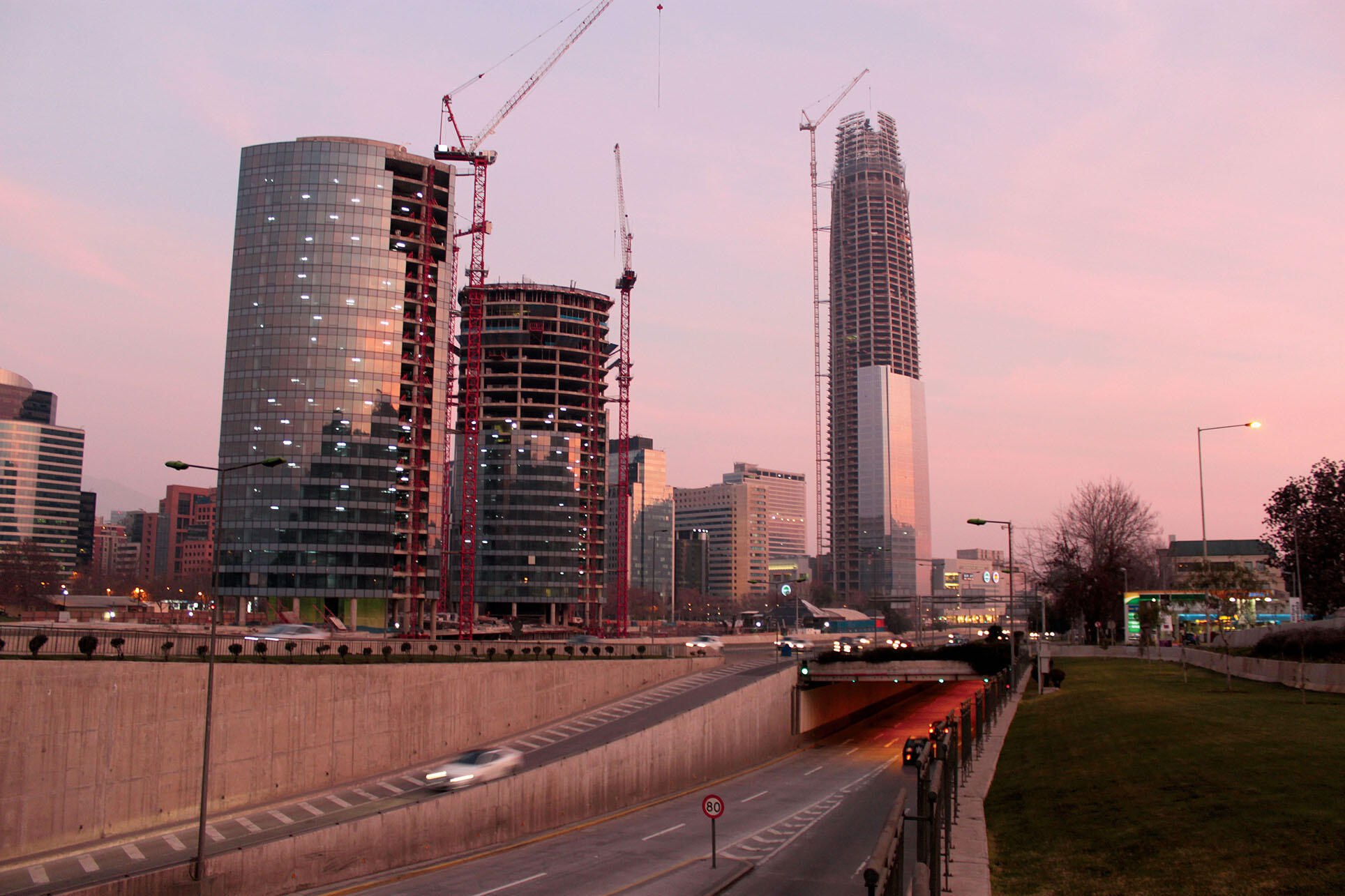 The large skyscrapers of the Costanera Center, pictured against the Santiago skyline, are emblematic of Chile's economic success. (Photo by Felipe Araya Allende.)
