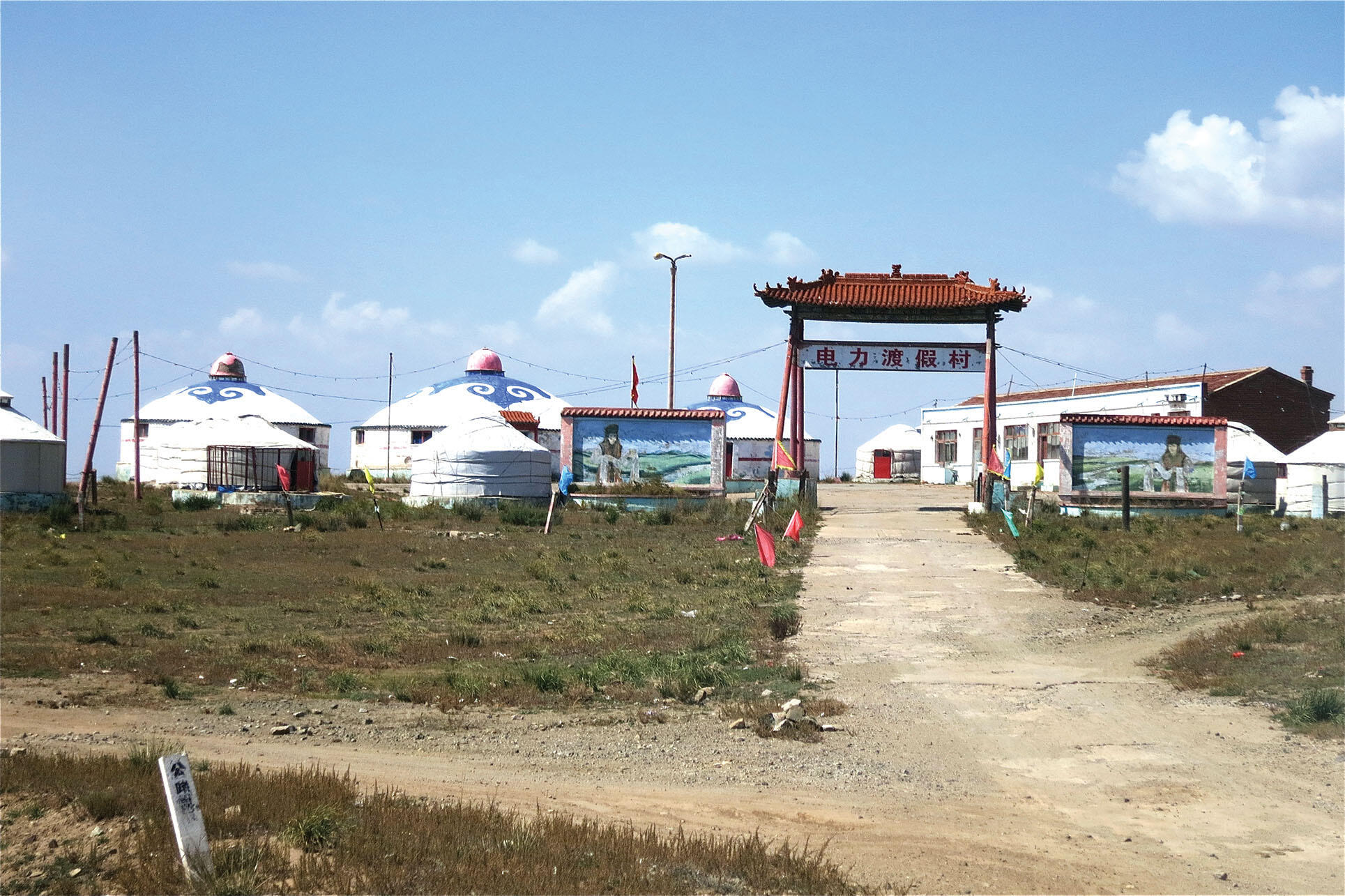 Concrete yurts in a dusty landscape for a supposedly “authentic Mongolian eco-tourism resort” built in an attempt to provide traditional herders with an alternate source of income. (Photo by Julie Klinger.)