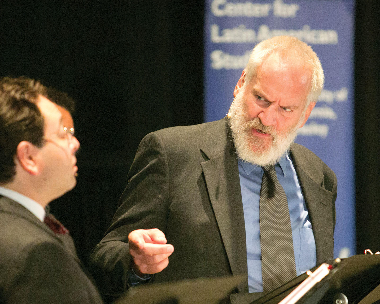 ulián López-Morillas as Pinochet gestures toward Anthony Nemirovsky during the reading of “Milton and Augusto.” (Photo by Jim Block.)