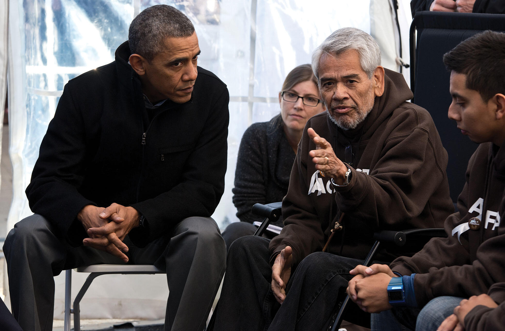 President Obama meets with Eliseo Medina, former executive vice president of the Service Employees  International Union, who was camped outside the U.S. Capitol and fasting for immigration reform, December 2013. (Photo by Nicholas Kamm/AFP/Getty Images.)