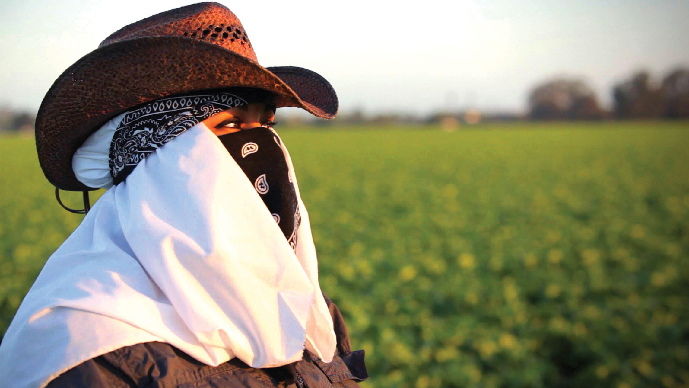 Maricruz Ladino stands in an agricultural field in Salinas. (Photo by Andrés Cediel.)