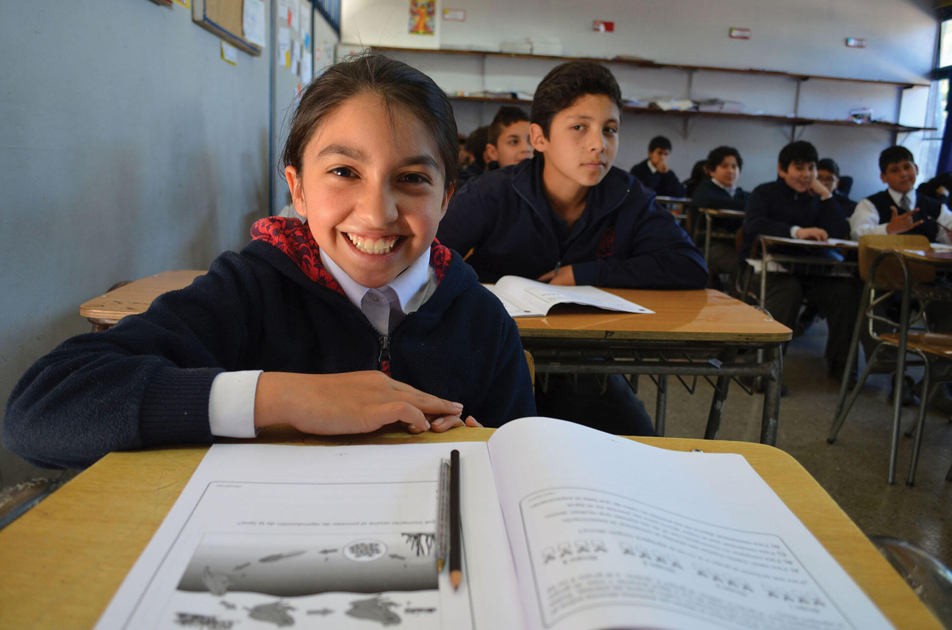 Uniformed Chilean school children sit in a classroom. (Photo courtesy of Orealc/Unesco Santiago.)