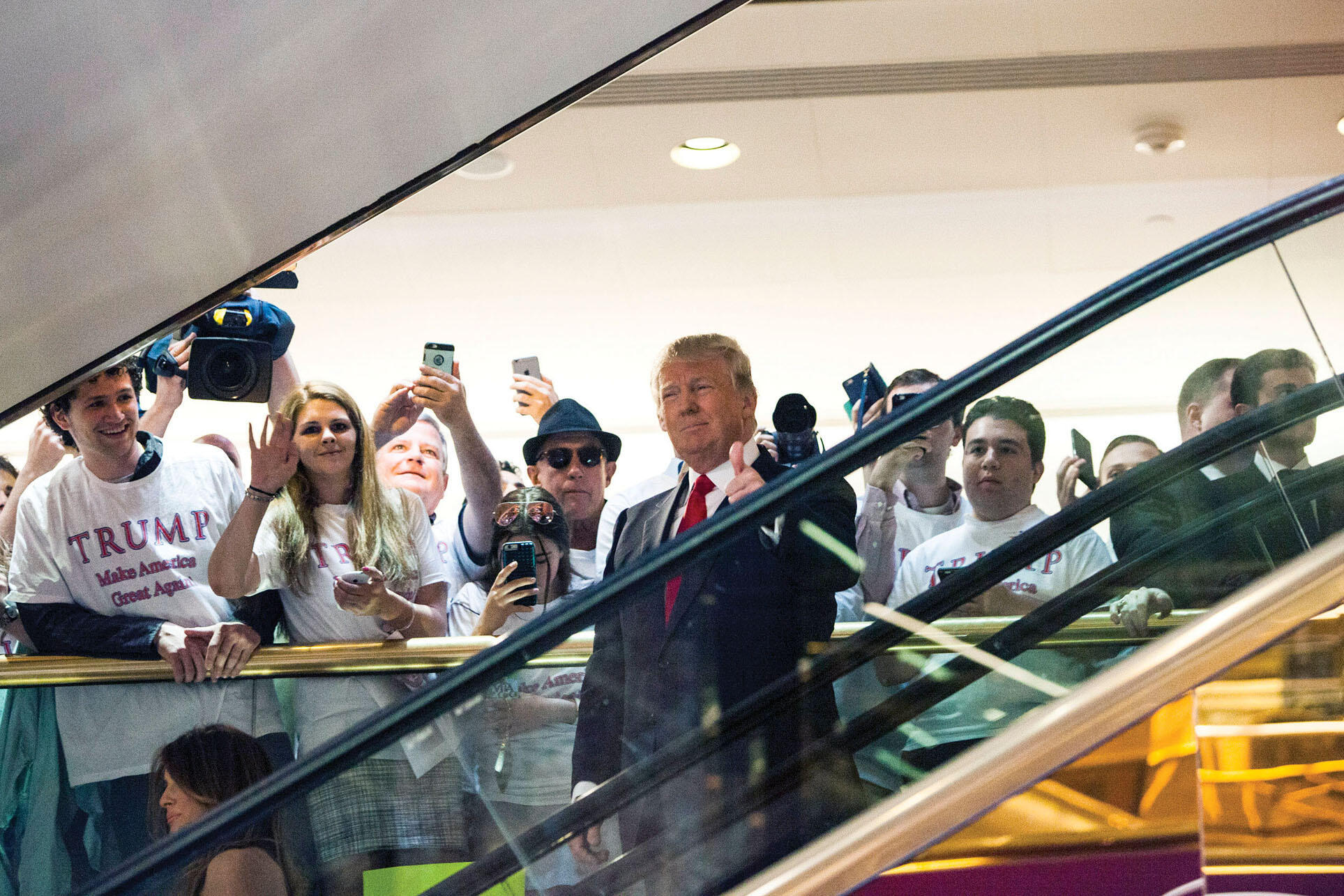 Donald Trump descends an escalator in Trump Tower to announce his candidacy for president, June 2015. (Photo by Tom Briglia/Getty Images.)