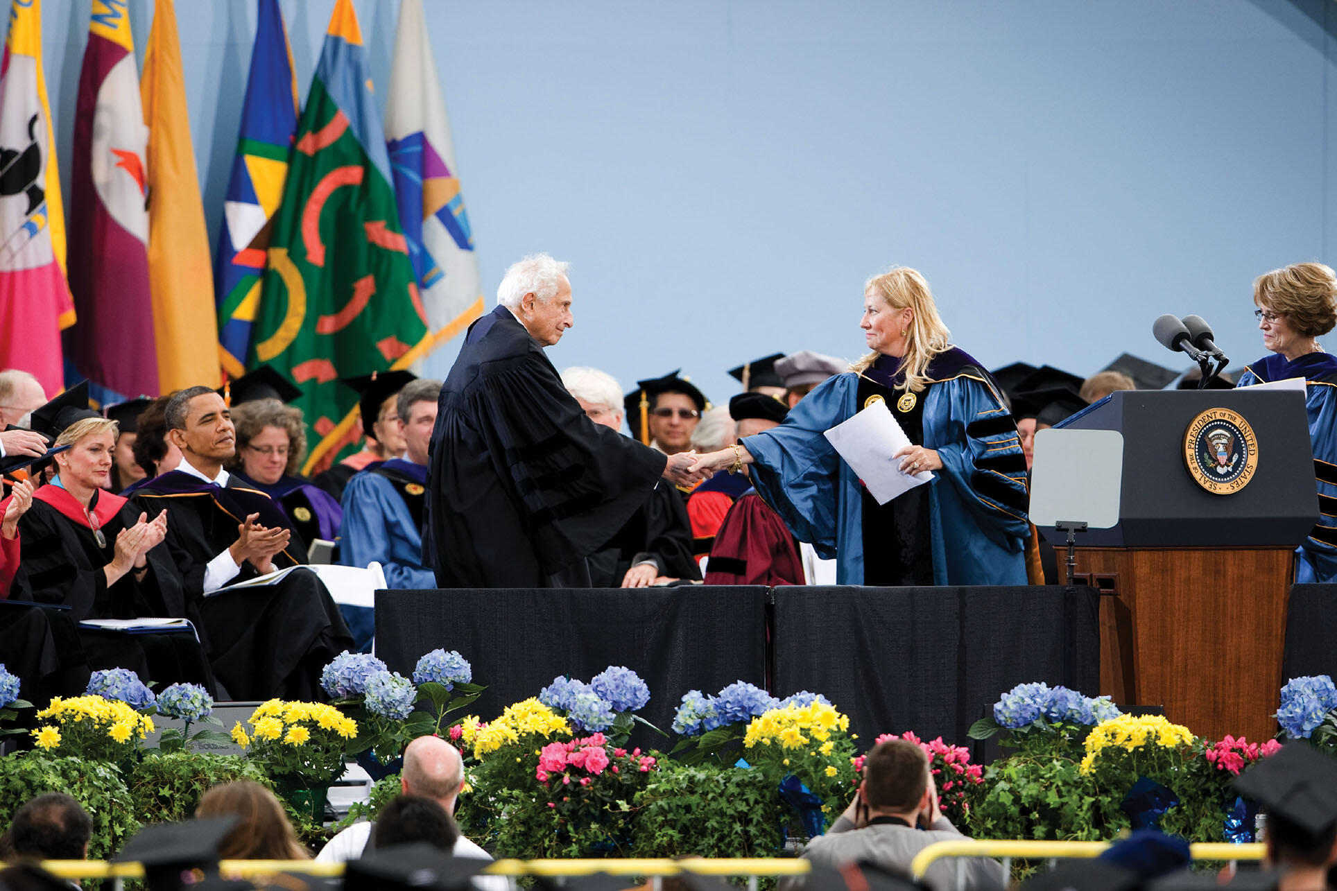 Stan Ovshinsky receives an honorary Doctor of Science degree from the University of Michigan,  Ann  Arbor, in 2010. At left, Michigan Governor Jennifer Granholm and President Barack Obama applaud. (Photo by Scott C. Soderberg/Michigan Photography.)