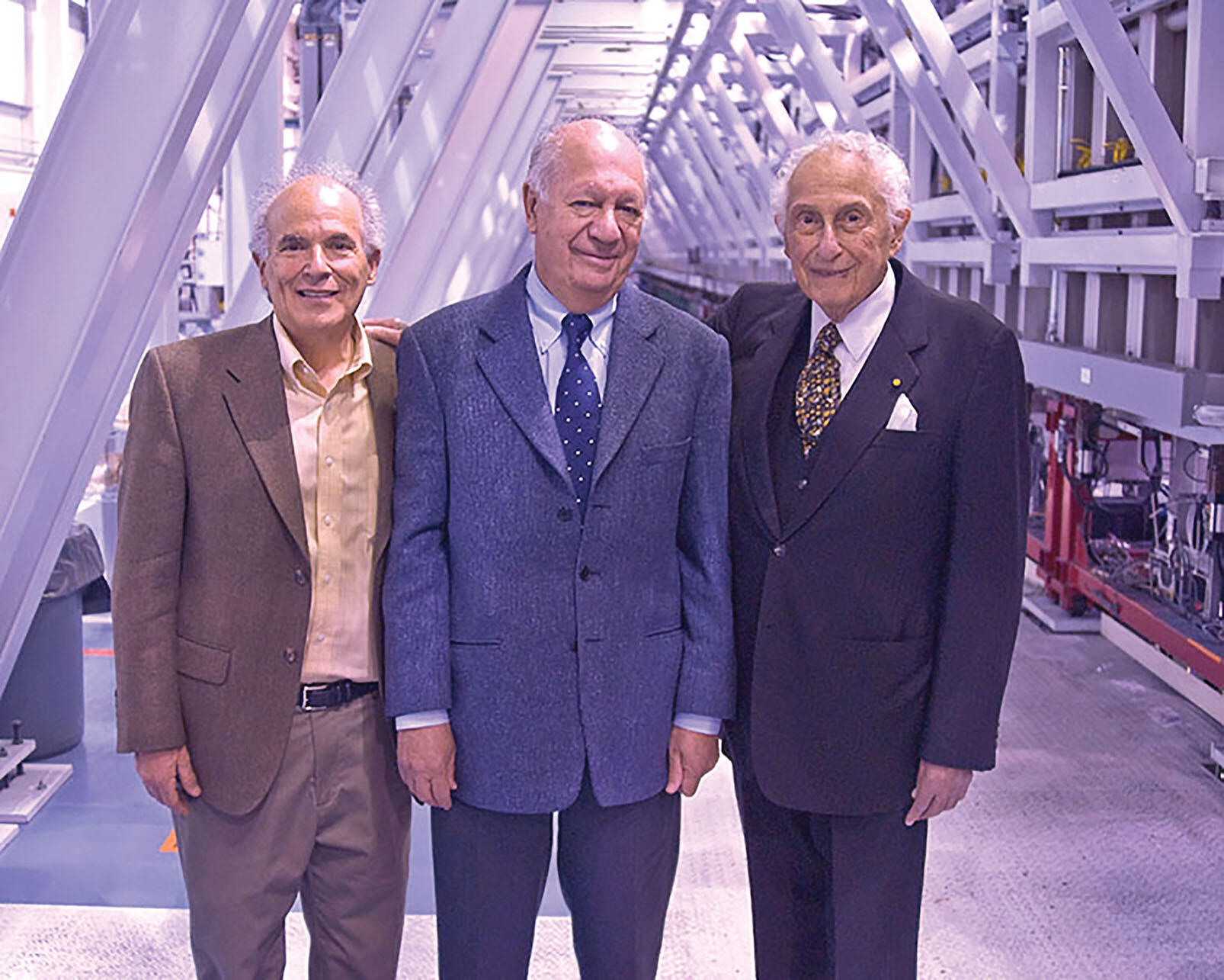 Stan Ovshinsky hosting Harley Shaiken and Ricardo Lagos at one of his continuous thin-film solar production machines in Detroit in 2009. (Photo by Brendan Ross.)