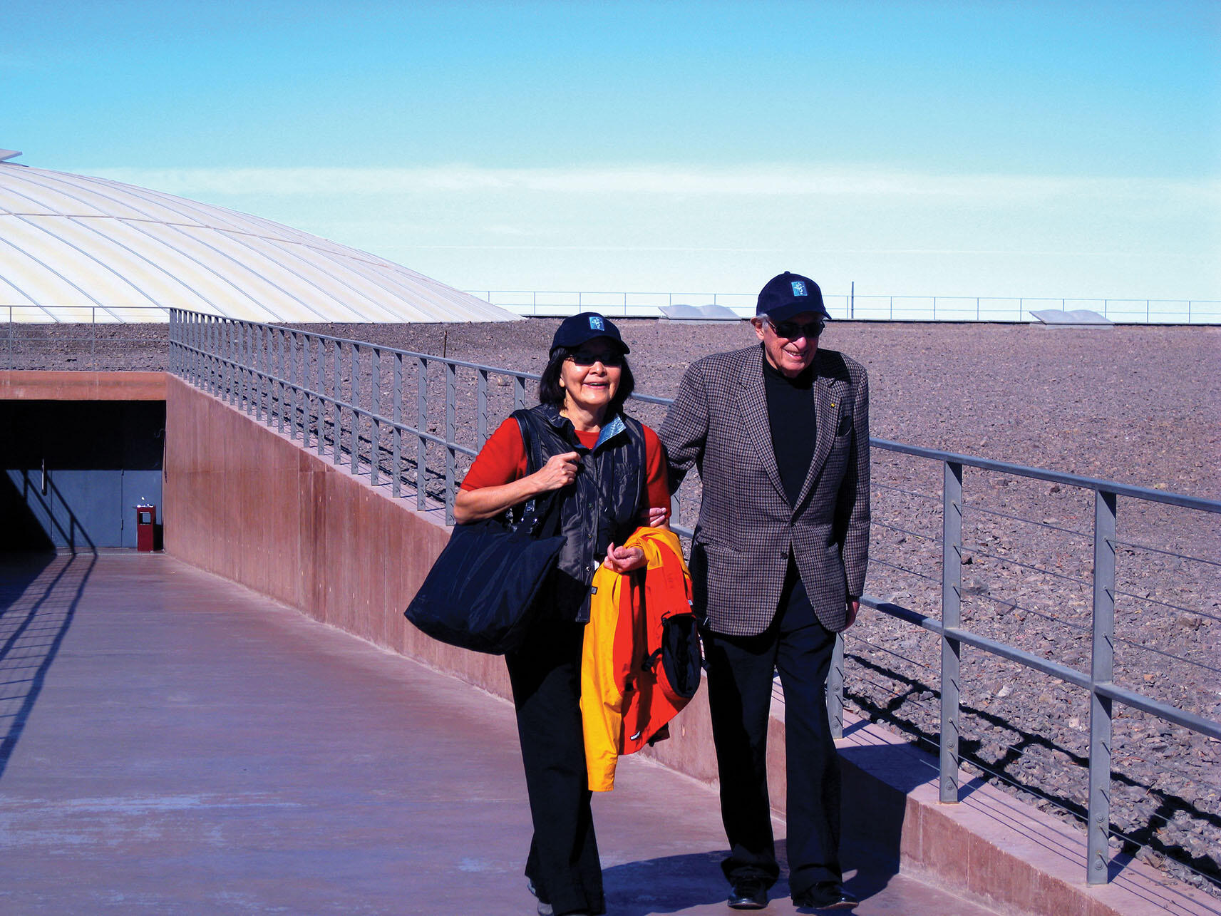 Stan and Rosa Ovshinsky outside the domes at the Paranal Observatory in Chile’s Atacama Desert, 2009. (Photo by Beatriz Manz.)
