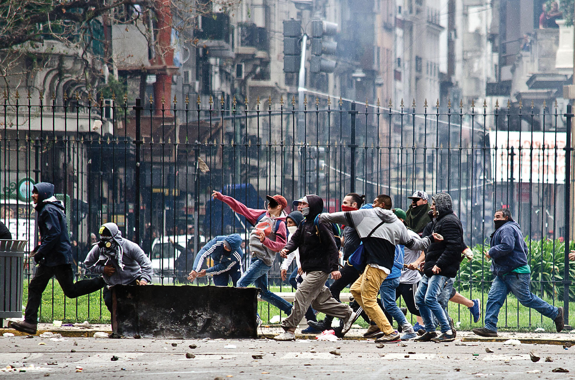  Protestors throw rocks during a protest against the IMF in downtown Buenos Aires, October 2018. (Photo by Santiago Sito.)