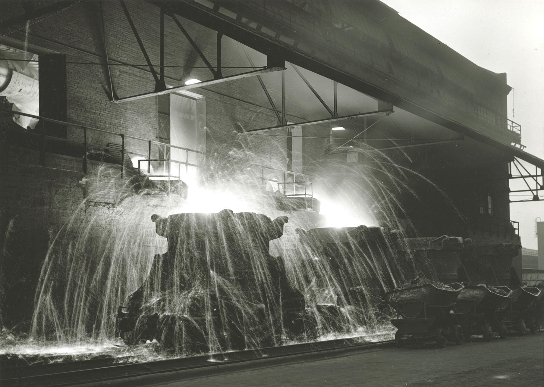 Molten iron pours from a blast furnace at the Rouge in 1932. (Photo from the Collections of  The Henry Ford Museum.)