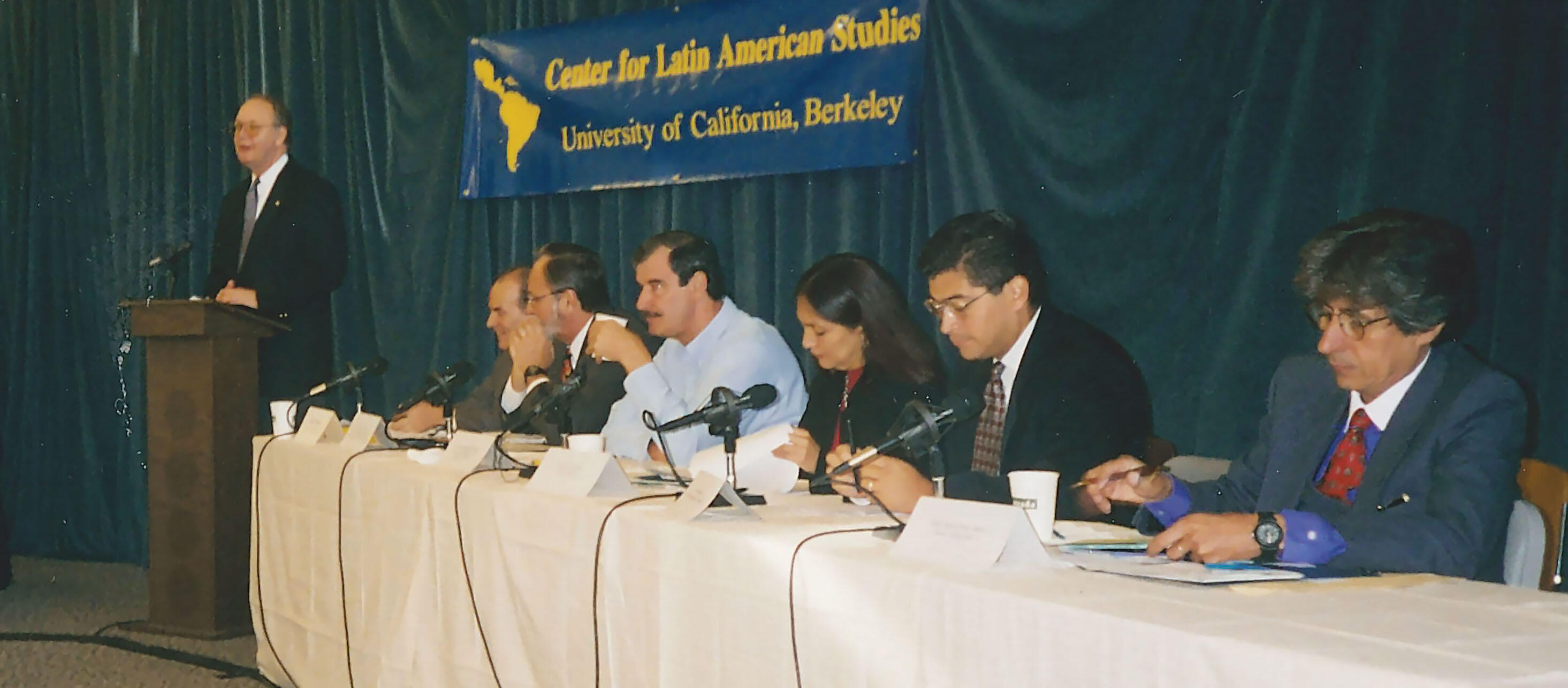 Harley Shaiken, David Bonior, Vicente Fox, Amalia García Medina, Xavier Becerra, and Adolfo Aguilar Zínser listen to UC Berkeley’s Chancellor, Robert Berdahl, at the Alternatives for the Americas conference, 1998. (Photo by CLAS staff.) Harley Shaiken, David Bonior, Vicente Fox, Amalia García Medina, Xavier Becerra, and Adolfo Aguilar Zínser listen to UC Berkeley’s Chancellor, Robert Berdahl, at the Alternatives for the Americas conference, 1998. (Photo by CLAS staff.)